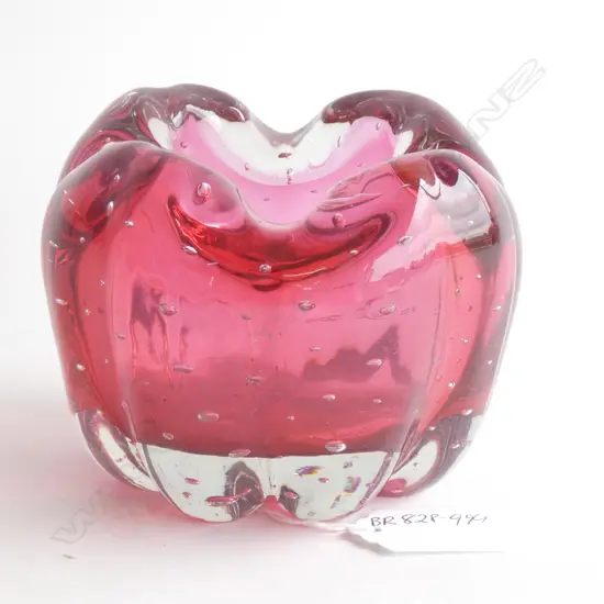 A melon shaped glass ashtray